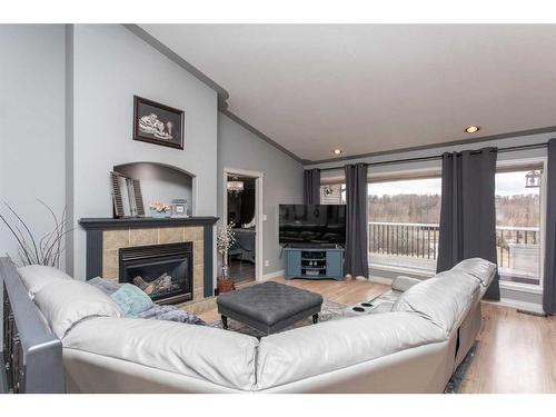 73-27121 Township Road 402, Rural Lacombe County, AB - Indoor Photo Showing Living Room With Fireplace