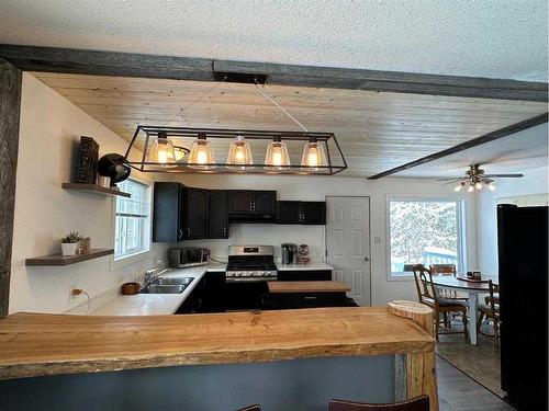 64 Tawatinaw Drive, Athabasca, AB - Indoor Photo Showing Kitchen With Double Sink