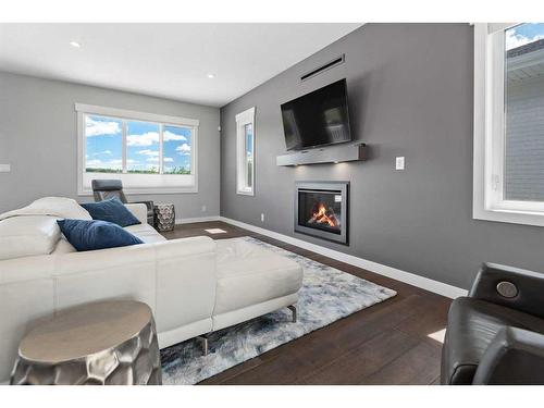 1 Toal Close, Red Deer, AB - Indoor Photo Showing Living Room With Fireplace