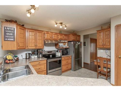 12 Pickwick Lane, Lacombe, AB - Indoor Photo Showing Kitchen With Double Sink