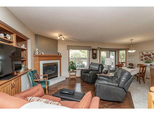 12 Pickwick Lane, Lacombe, AB - Indoor Photo Showing Living Room With Fireplace