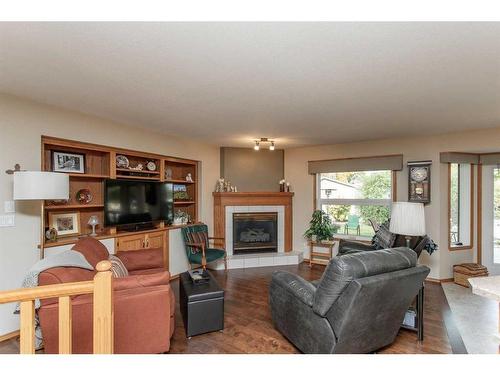 12 Pickwick Lane, Lacombe, AB - Indoor Photo Showing Living Room With Fireplace