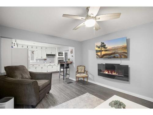 3908 45A Street, Ponoka, AB - Indoor Photo Showing Living Room With Fireplace