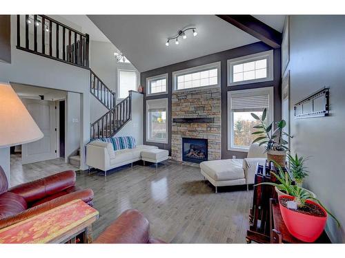 76 Burris Pointe, Lacombe, AB - Indoor Photo Showing Other Room With Fireplace