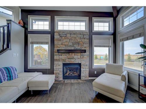 76 Burris Pointe, Lacombe, AB - Indoor Photo Showing Living Room With Fireplace