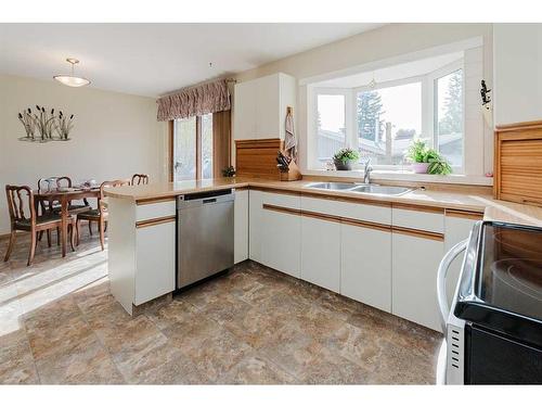 4529 35 Street Crescent, Red Deer, AB - Indoor Photo Showing Kitchen With Double Sink