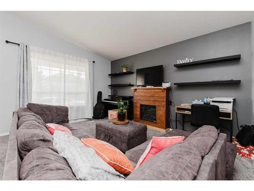 143 Deschner Close, Red Deer, AB - Indoor Photo Showing Living Room With Fireplace