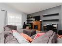 143 Deschner Close, Red Deer, AB  - Indoor Photo Showing Living Room With Fireplace 