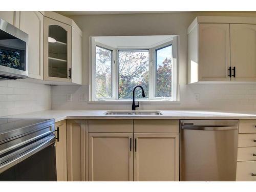 120 Pamely Avenue, Red Deer, AB - Indoor Photo Showing Kitchen With Double Sink