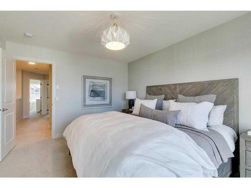 32 Treeline Manor Sw, Calgary, AB - Indoor Photo Showing Bedroom