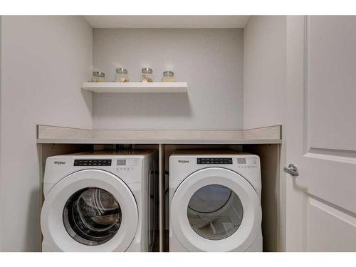 32 Treeline Manor Sw, Calgary, AB - Indoor Photo Showing Laundry Room