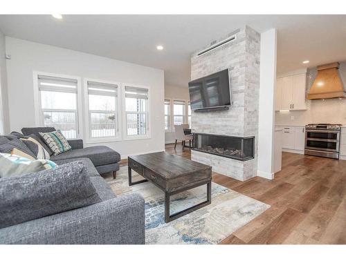 77 Longmire Close, Red Deer, AB - Indoor Photo Showing Living Room With Fireplace