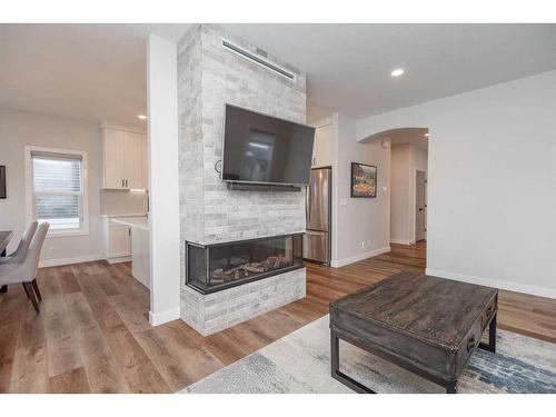 77 Longmire Close, Red Deer, AB - Indoor Photo Showing Living Room With Fireplace