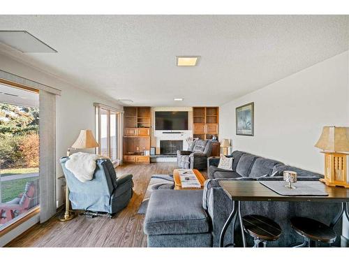 6007 43 Avenue, Stettler, AB - Indoor Photo Showing Living Room With Fireplace