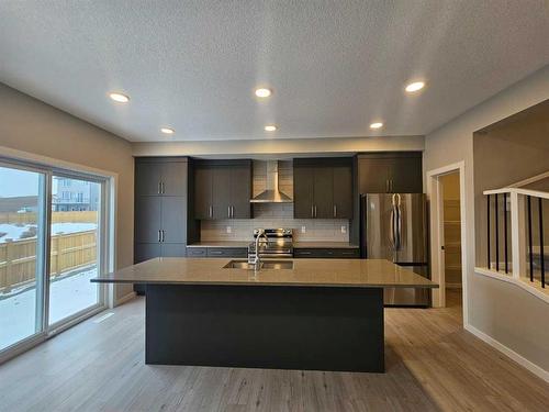 84 Key Cove Sw, Airdrie, AB - Indoor Photo Showing Kitchen With Double Sink With Upgraded Kitchen