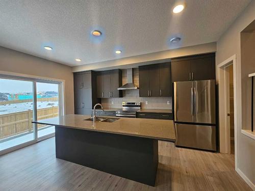 84 Key Cove Sw, Airdrie, AB - Indoor Photo Showing Kitchen With Double Sink