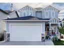 147 Sunset Close North, Cochrane, AB  - Outdoor With Facade 