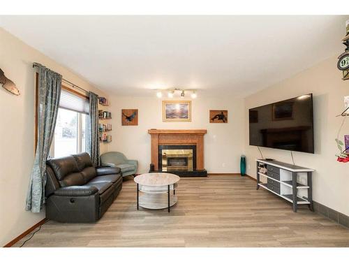 6027 69 Avenue, Rocky Mountain House, AB - Indoor Photo Showing Living Room With Fireplace