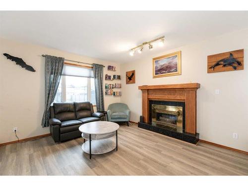 6027 69 Avenue, Rocky Mountain House, AB - Indoor Photo Showing Living Room With Fireplace