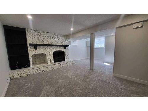 259 Manora Crescent Ne, Calgary, AB - Indoor With Fireplace