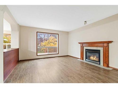 9 Lanterman Close, Red Deer, AB - Indoor Photo Showing Living Room With Fireplace