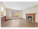 9 Lanterman Close, Red Deer, AB  - Indoor Photo Showing Living Room With Fireplace 