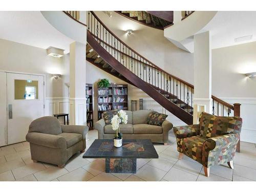 306-4425 Heritage Way, Lacombe, AB - Indoor Photo Showing Living Room