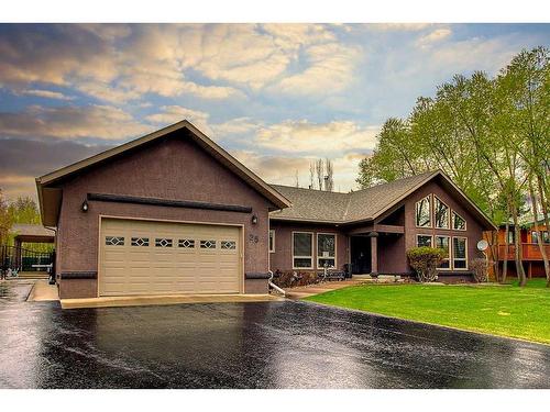 25 Ravenscrag Crescent, Norglenwold, AB - Outdoor With Deck Patio Veranda