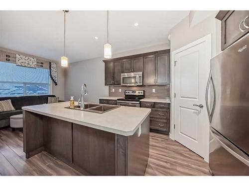 51 Reid Court, Sylvan Lake, AB - Indoor Photo Showing Kitchen With Stainless Steel Kitchen With Double Sink With Upgraded Kitchen