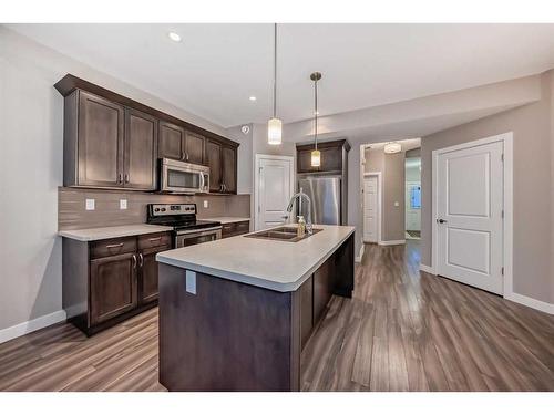 51 Reid Court, Sylvan Lake, AB - Indoor Photo Showing Kitchen With Stainless Steel Kitchen With Double Sink With Upgraded Kitchen