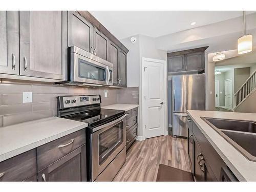 51 Reid Court, Sylvan Lake, AB - Indoor Photo Showing Kitchen With Stainless Steel Kitchen With Double Sink With Upgraded Kitchen