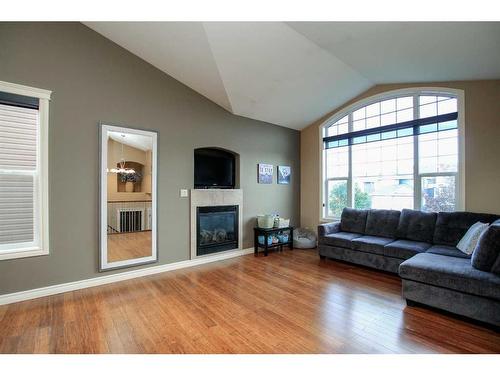 7123 Henner'S Road, Lacombe, AB - Indoor Photo Showing Living Room With Fireplace