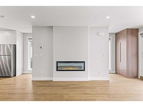 Unit 3-1615 1 Avenue, Canmore, AB - Indoor With Fireplace