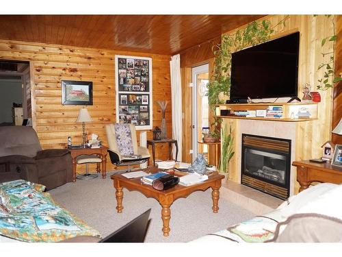 53021A Township Rd 37-2, Rural Clearwater County, AB - Indoor Photo Showing Living Room With Fireplace