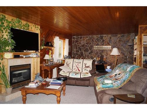 53021A Township Rd 37-2, Rural Clearwater County, AB - Indoor Photo Showing Living Room With Fireplace