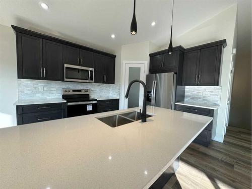 4745 Aspen Lakes Boulevard, Blackfalds, AB - Indoor Photo Showing Kitchen With Stainless Steel Kitchen With Double Sink With Upgraded Kitchen