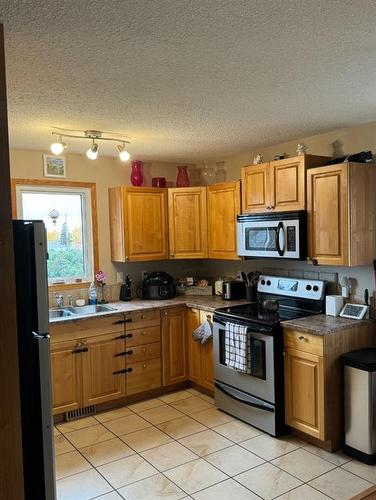 5117 52 Street, Rocky Mountain House, AB - Indoor Photo Showing Kitchen With Double Sink