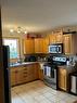 5117 52 Street, Rocky Mountain House, AB  - Indoor Photo Showing Kitchen With Double Sink 