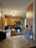 5117 52 Street, Rocky Mountain House, AB  - Indoor Photo Showing Kitchen With Double Sink 