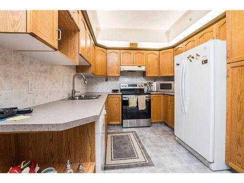 416-4805 45 Street, Red Deer, AB - Indoor Photo Showing Kitchen With Double Sink