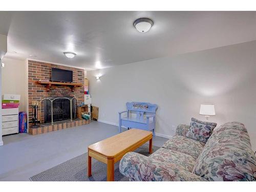 47 Oberlin Avenue, Red Deer, AB - Indoor Photo Showing Living Room With Fireplace