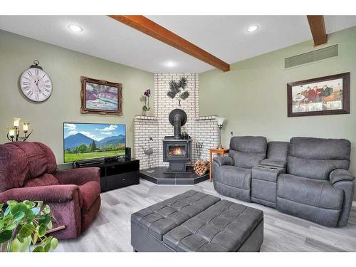 5420 58A Street Crescent, Lacombe, AB - Indoor Photo Showing Living Room With Fireplace