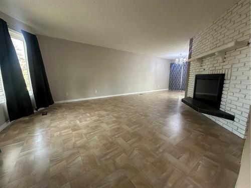 5421 51 Street, Camrose, AB - Indoor Photo Showing Other Room With Fireplace