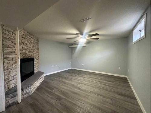 5421 51 Street, Camrose, AB - Indoor Photo Showing Other Room With Fireplace