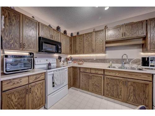 4615 44 Street, Red Deer, AB - Indoor Photo Showing Kitchen With Double Sink