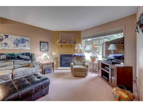 4615 44 Street, Red Deer, AB - Indoor Photo Showing Living Room With Fireplace