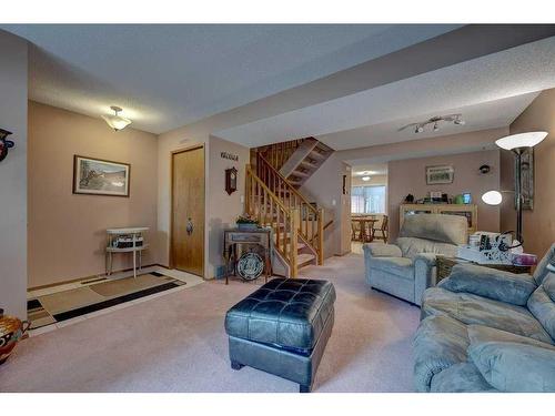 4615 44 Street, Red Deer, AB - Indoor Photo Showing Living Room With Fireplace