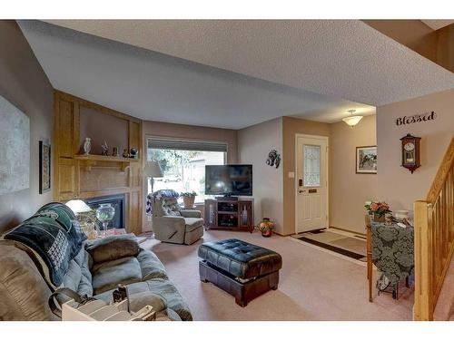 4615 44 Street, Red Deer, AB - Indoor Photo Showing Living Room With Fireplace