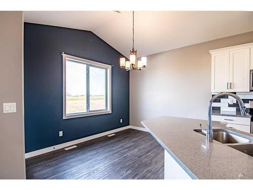 54 Metcalf Way, Lacombe, AB - Indoor Photo Showing Kitchen With Double Sink