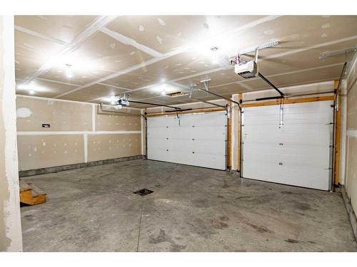 54 Metcalf Way, Lacombe, AB - Indoor Photo Showing Garage